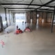 Grote bedrijfsloods met betonnen vloer in Beek en Donk